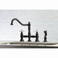 Kingston KS3277PXBS Restoration Bridge Kitchen Faucet with Brass Sprayer, Brushed Brass in a classic kitchen setting