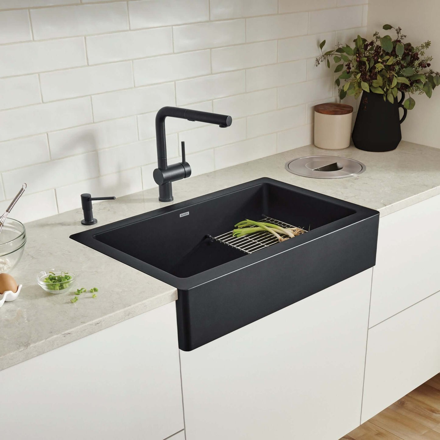 BLANCO VINTERA 30" SILGRANIT Single Bowl Farmhouse Sink with modern faucet and fresh vegetables on a stylish countertop.