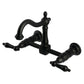 Kingston KS1263PKL Duchess Two-Handle Wall Mount Bridge Kitchen Faucet, Antique Brass with black porcelain handles.