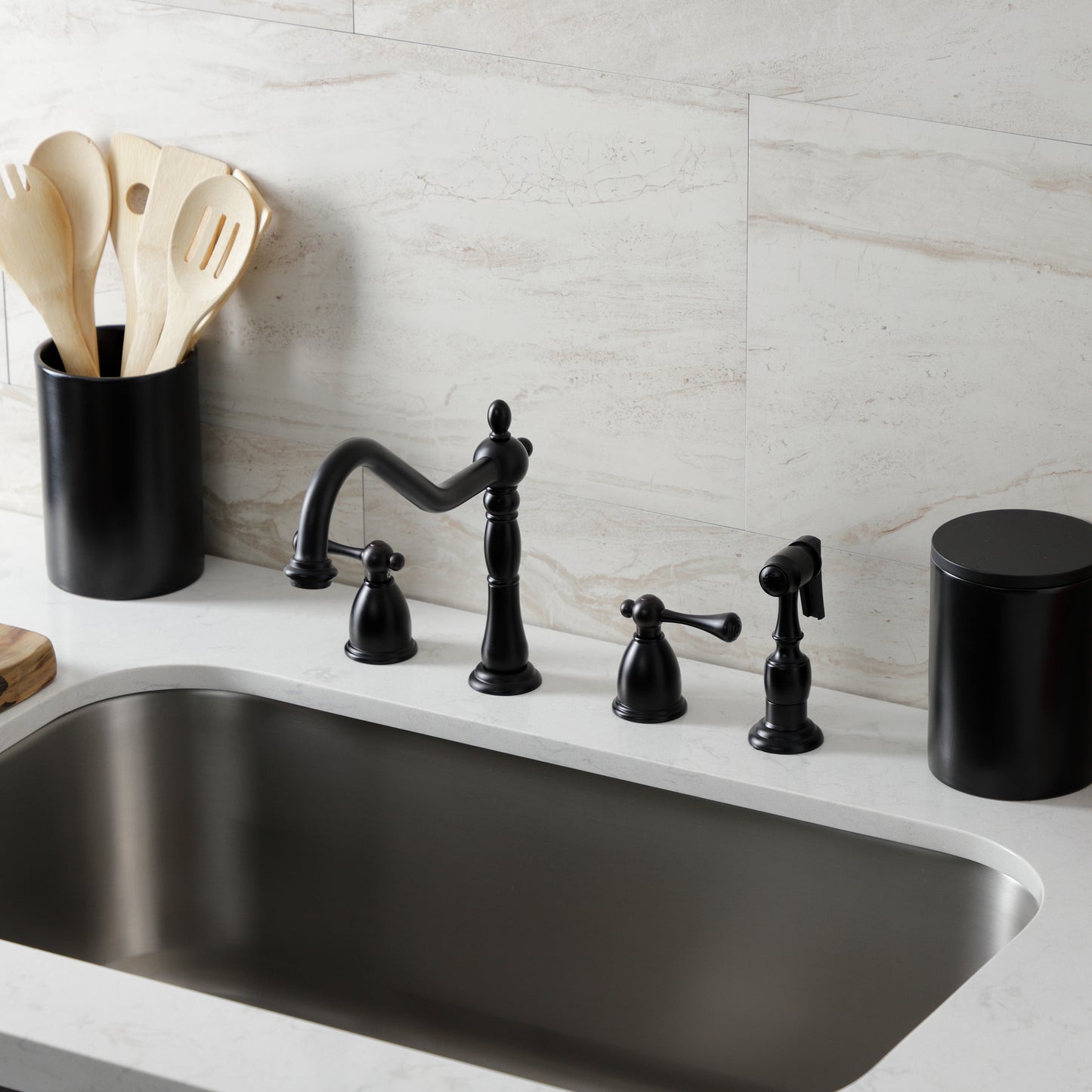 Kingston Brass KB1793BLBS Heritage Double-Handle Widespread Kitchen Faucet with Brass Sprayer, Antique Brass in a kitchen setting.