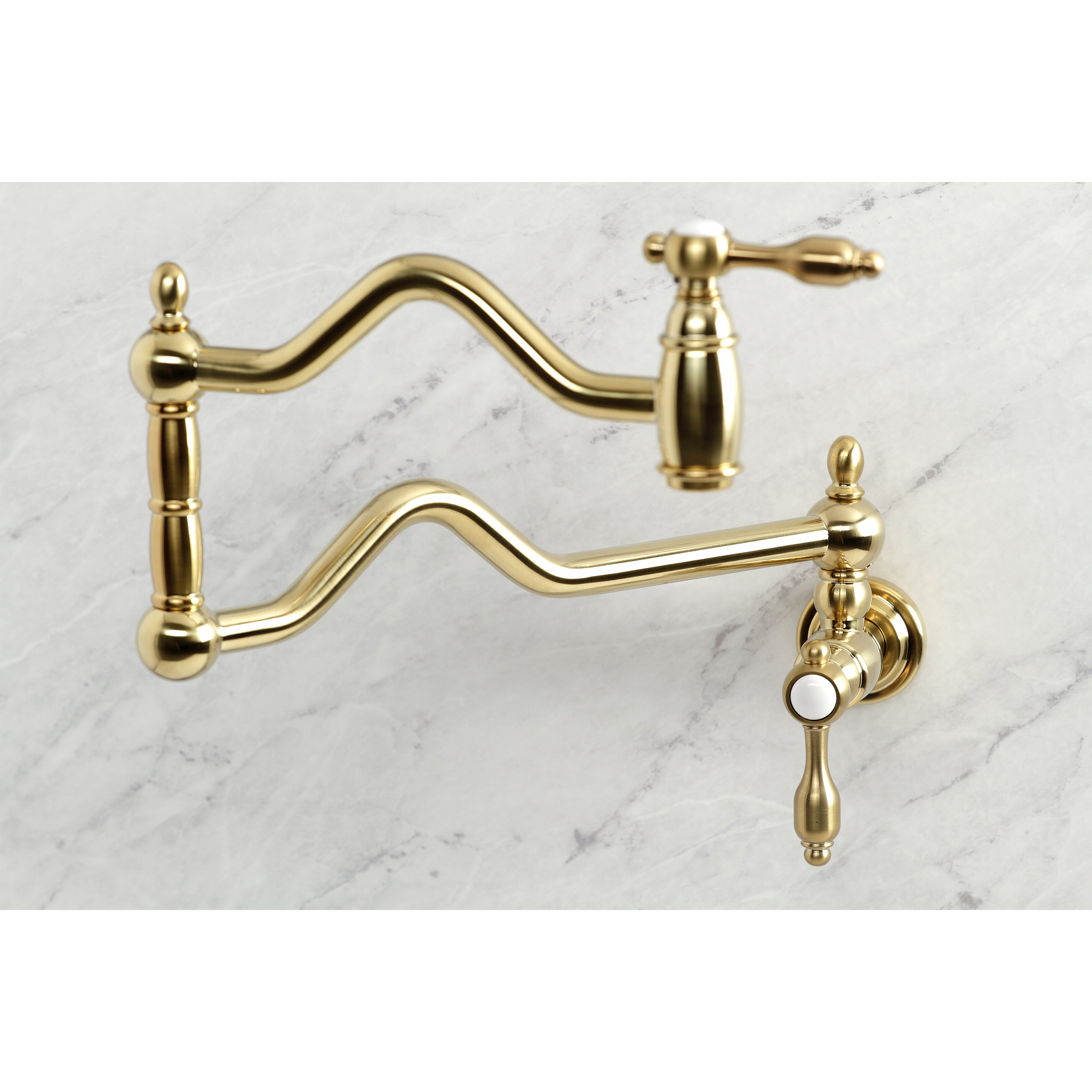 Kingston Brass KS2107TAL Tudor Wall Mount Pot Filler Faucet, Brushed Brass on a marble background.