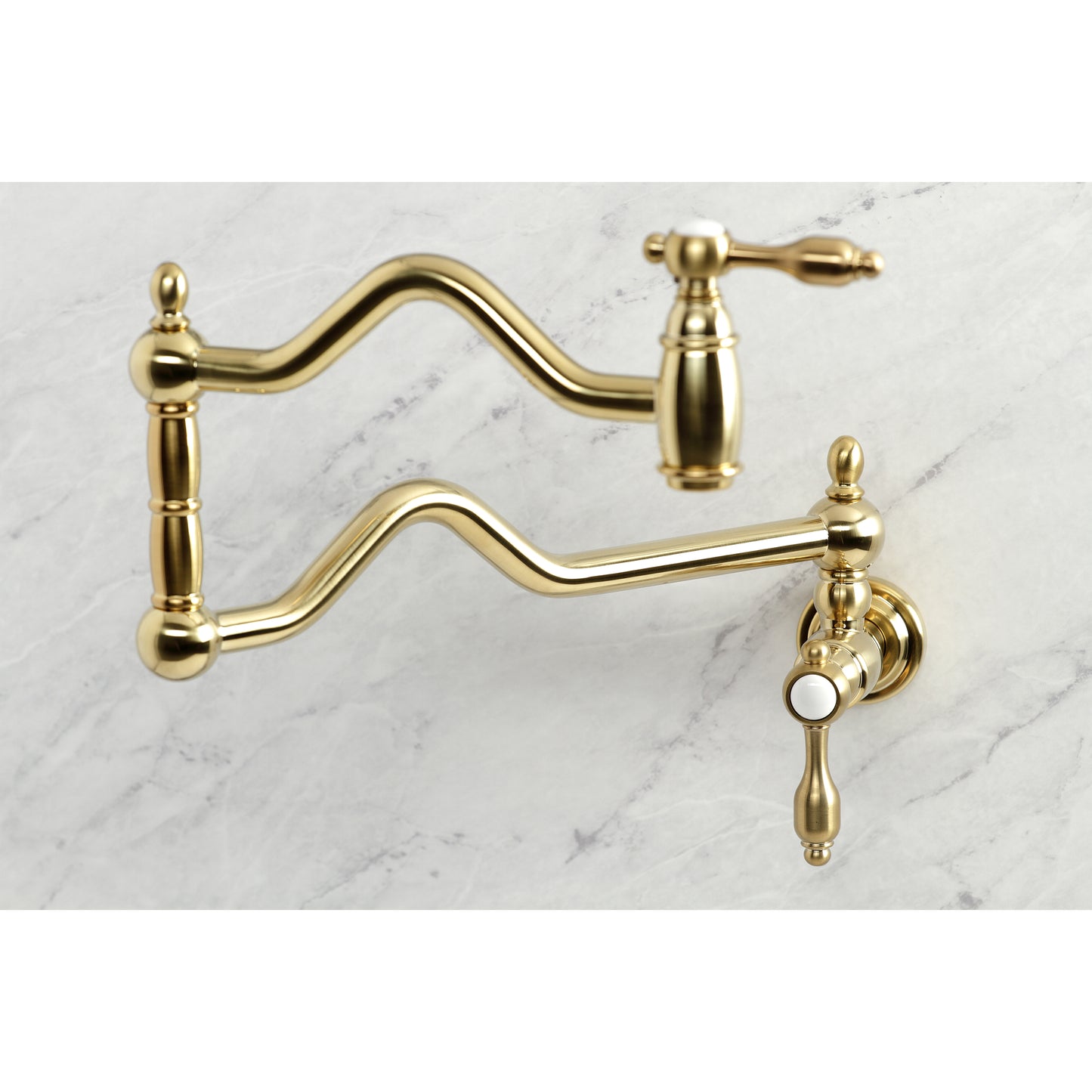 Kingston Brass KS2107TAL Tudor Wall Mount Pot Filler Faucet, Brushed Brass on a marble background.