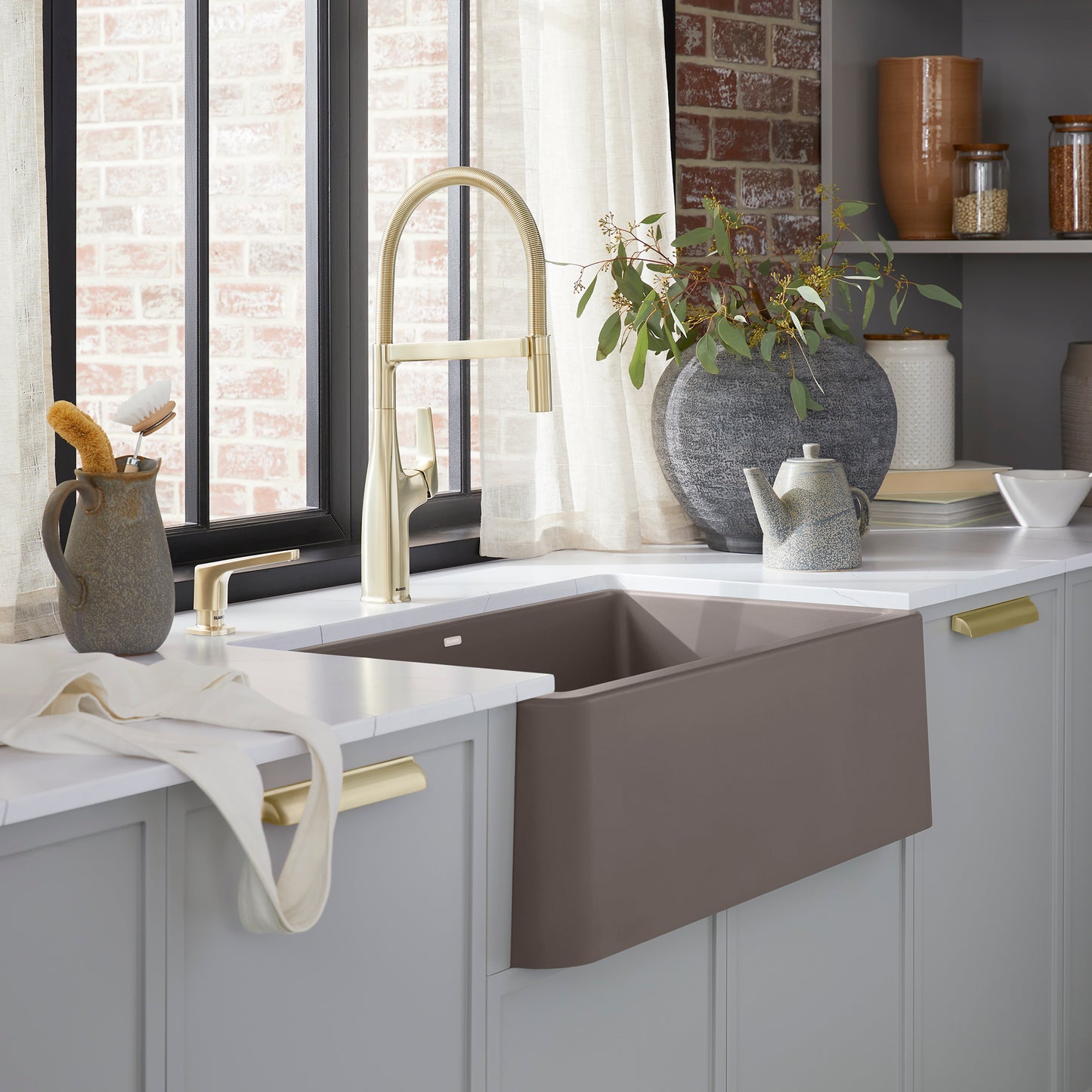 BLANCO Ikon SILGRANIT 30" Single Bowl Apron-Front Farmhouse Sink in a stylish kitchen setting with modern fixtures.