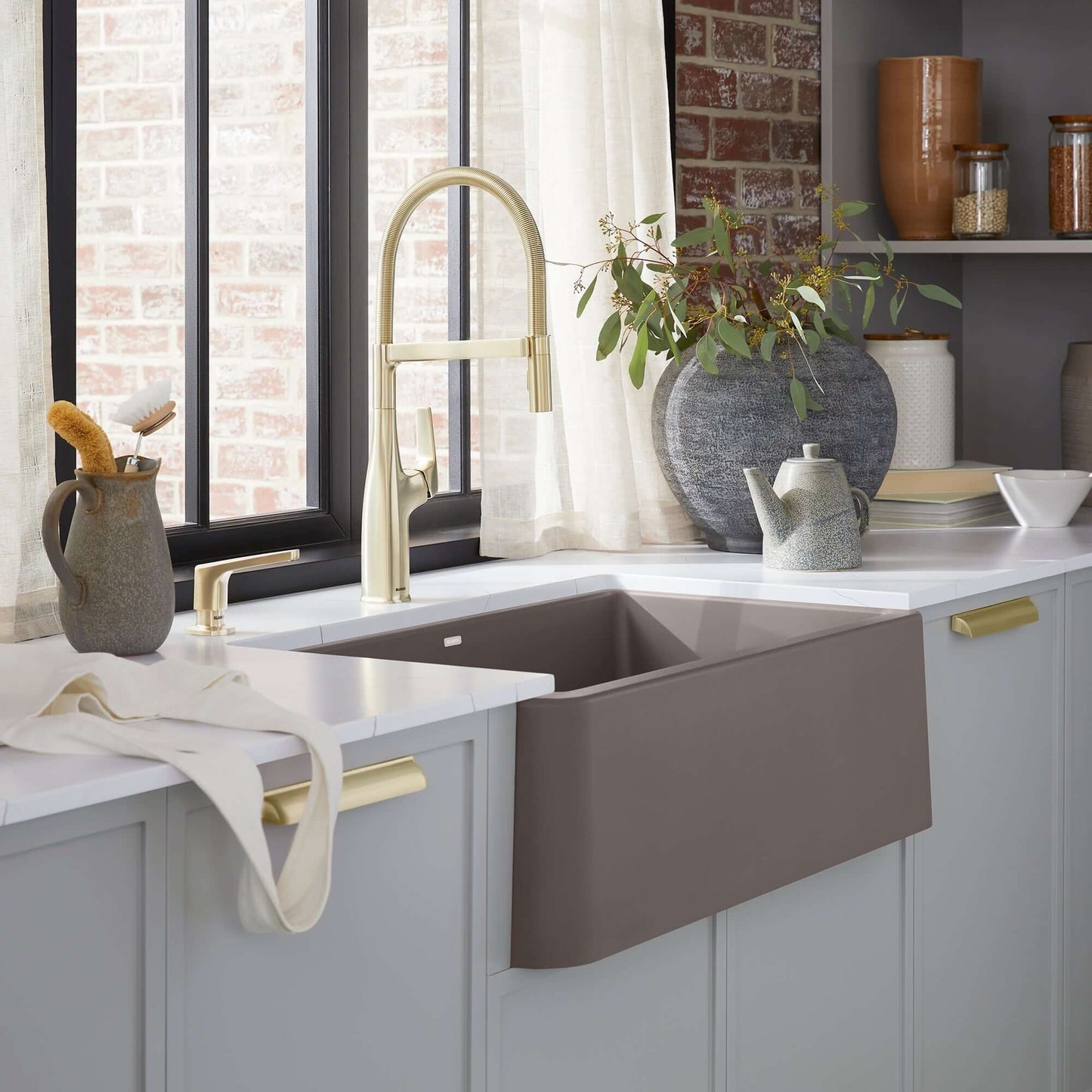BLANCO Ikon SILGRANIT 33" Single Bowl Apron-Front Farmhouse Sink showcasing a stylish kitchen setup with modern faucet.