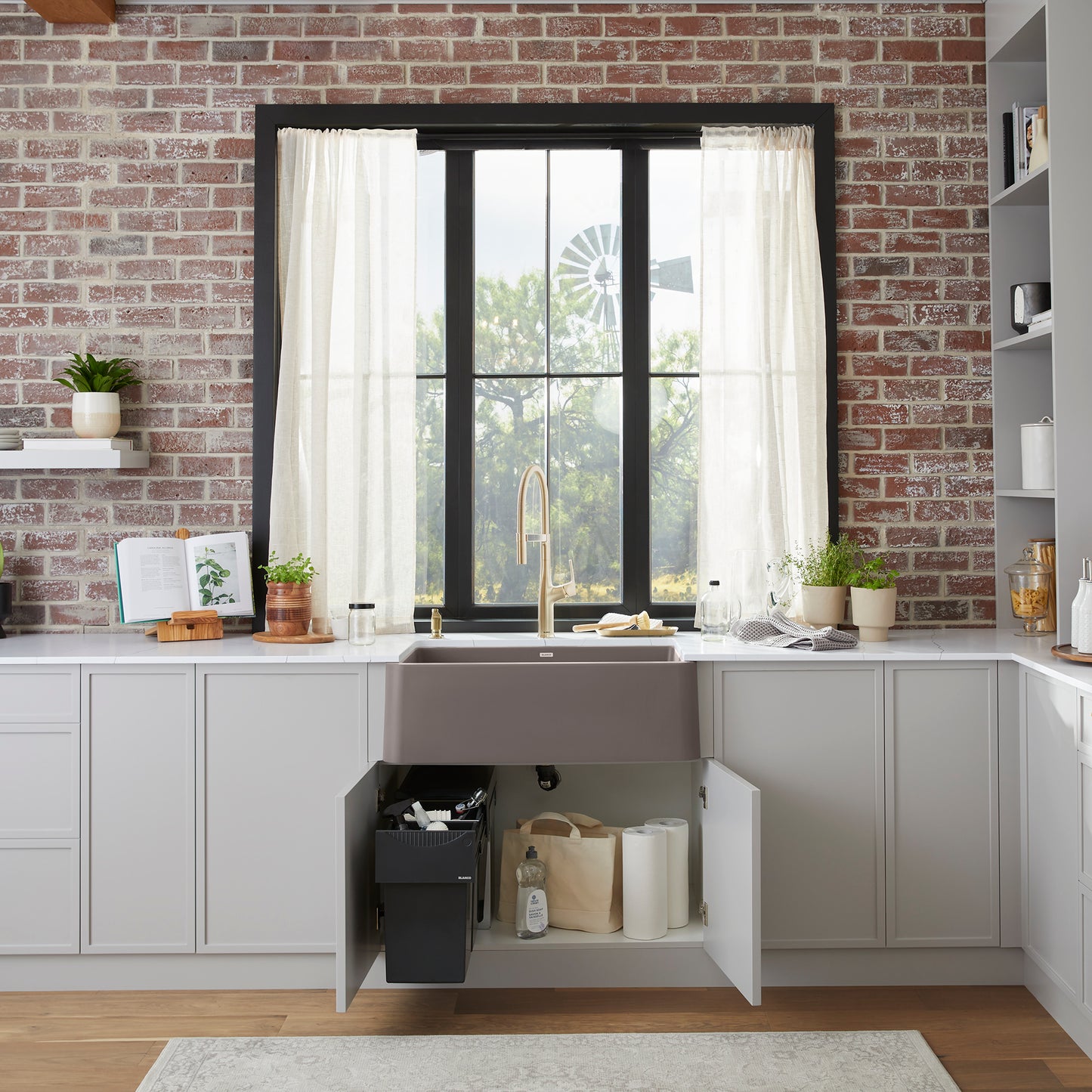 BLANCO Ikon SILGRANIT 30" Single Bowl Apron-Front Farmhouse Sink in a modern kitchen setting with open cabinetry.
