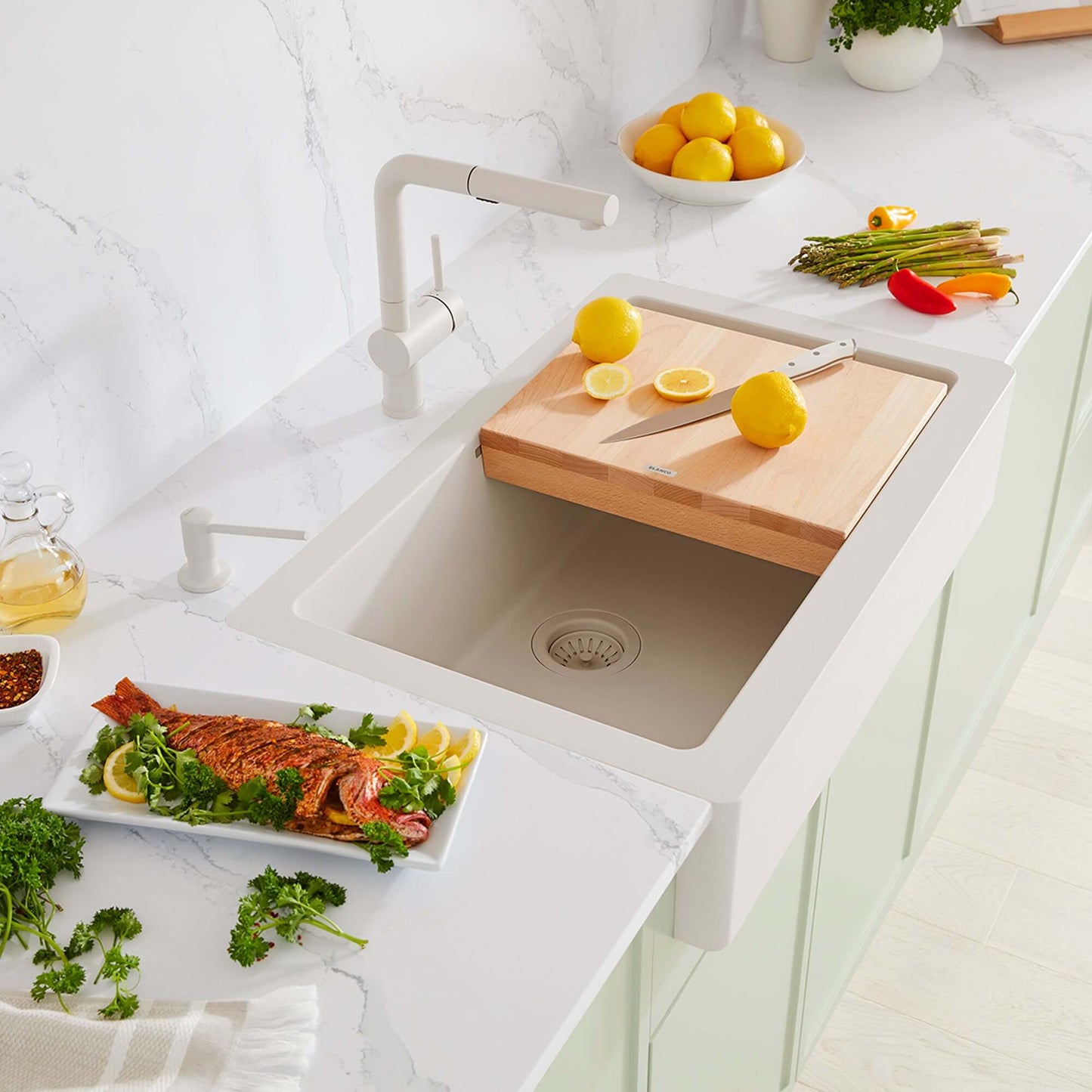 BLANCO Linus Low Arc Pull-Out Dual-Spray Kitchen Faucet - Soft White in a modern kitchen with fresh ingredients.