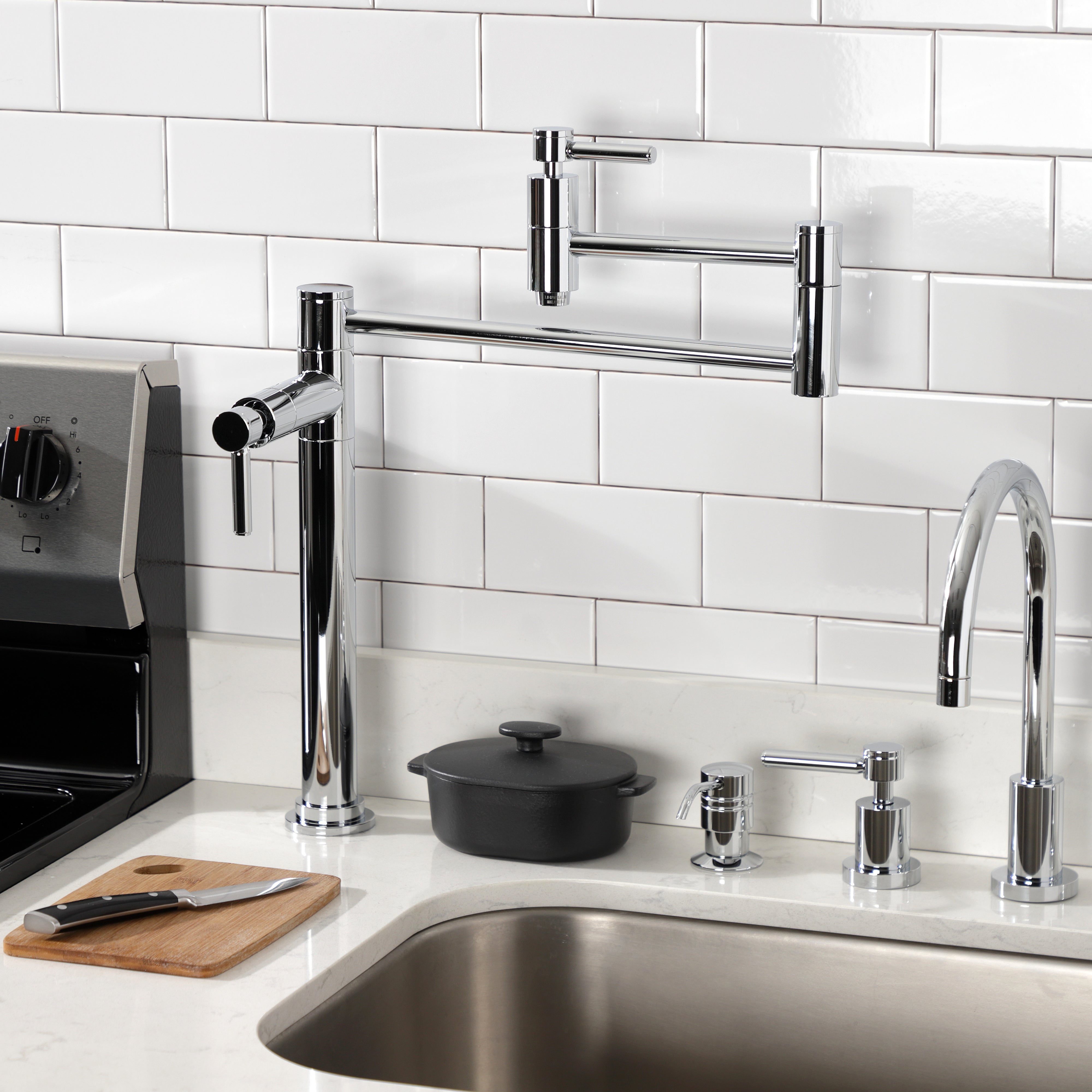Kingston Brass KS870DLAC Concord Deck Mount Pot Filler Faucet, Antique Copper installed in modern kitchen.