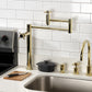 Kingston Brass KS8707DX Concord Deck Mount Pot Filler Faucet, Brushed Brass in modern kitchen setting