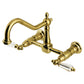Kingston KS1243WLL Wilshire Two-Handle Wall Mount Bridge Kitchen Faucet, Antique Brass with acrylic lever handles.