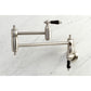 Kingston Brass KS3103PKL Duchess Wall Mount Pot Filler Faucet, Antique Brass with black porcelain handles.