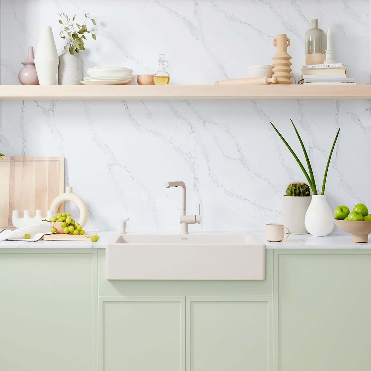 BLANCO VINTERA 30" SILGRANIT Single Bowl Farmhouse Sink in a modern kitchen setting with green cabinetry.
