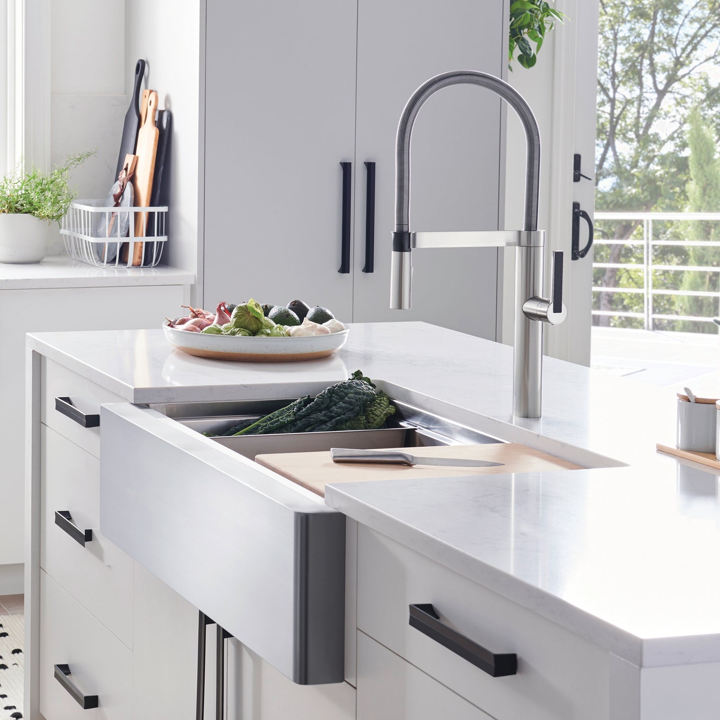 BLANCO Quatrus R15 Ergon 33" Single Bowl Apron-Front Stainless Steel Farmhouse Sink in a modern kitchen setting.