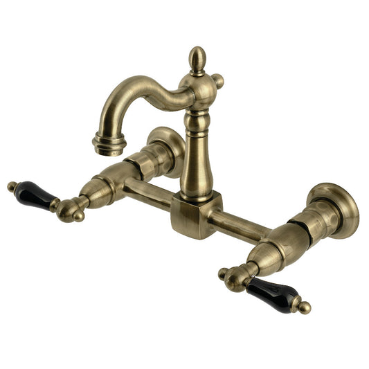 Kingston KS2443PKL Duchess Two-Handle Wall Mount Bridge Kitchen Faucet, Antique Brass with black handles.
