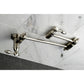 Kingston Brass KS3103TAL Tudor Wall Mount Pot Filler Faucet, Antique Brass on a marble backsplash.