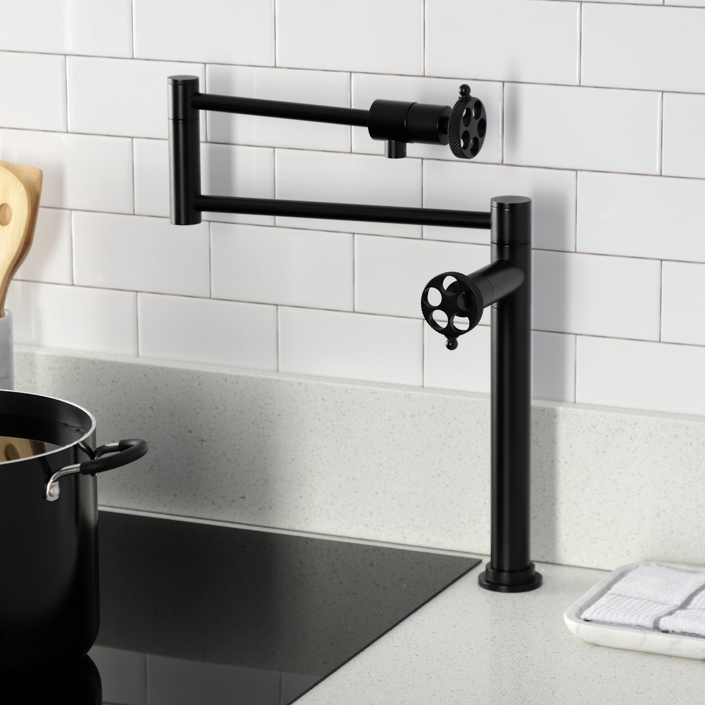Kingston Brass KS4703RKX Webb Deck Mount Pot Filler Faucet with Knurled Handle, Antique Brass in a modern kitchen setting.