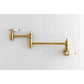 Kingston Brass KS3103BPL Bel-Air Wall Mount Pot Filler Faucet, Antique Brass on kitchen wall.