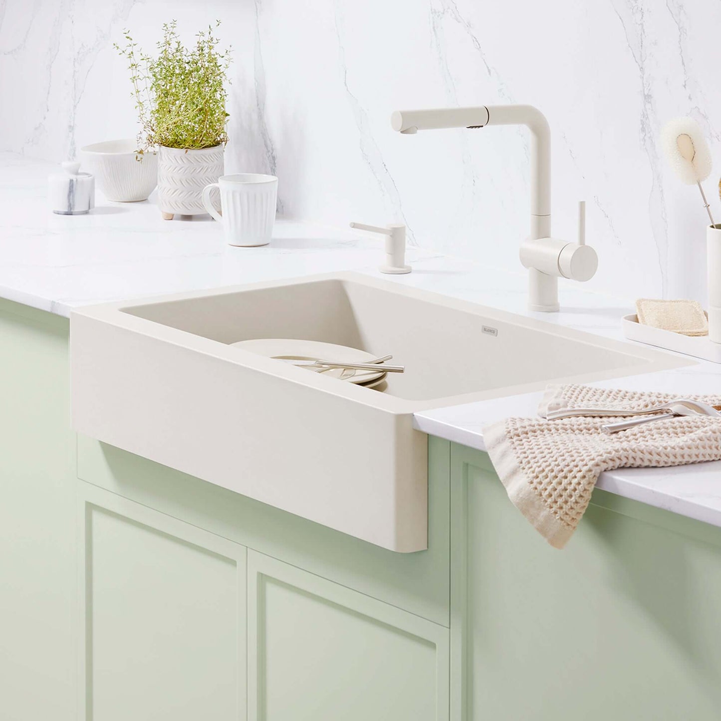 BLANCO Linus Low Arc Pull-Out Dual-Spray Kitchen Faucet - White displayed over a modern kitchen sink.