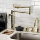 Kingston Brass KS4703CML Manhattan Deck Mount Pot Filler Faucet, Antique Brass in contemporary kitchen setting