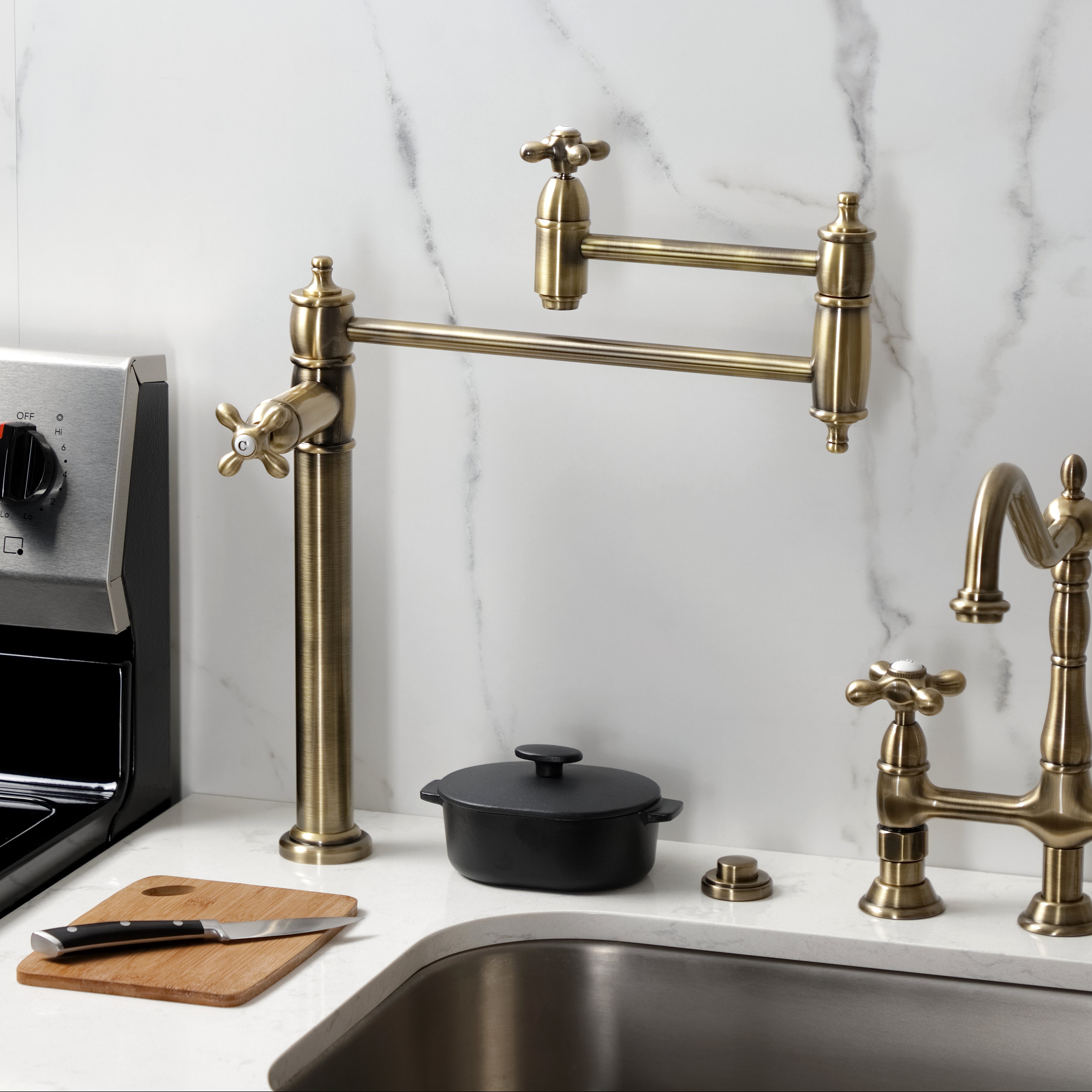 Kingston Brass KS3703AX Restoration Deck Mount Pot Filler Faucet, Antique Brass on a countertop with stove.