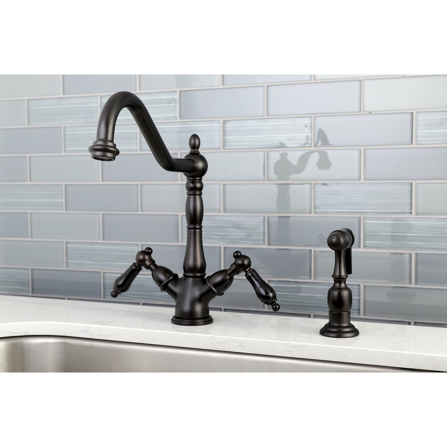 Kingston KS1238PKLBS Duchess Two-Handle Kitchen Faucet with Brass Sprayer, Brushed Nickel in a modern kitchen setting.