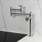 Kingston Brass KS3703CG Fuller Deck Mount Pot Filler Faucet, Antique Brass on countertop with modern design.