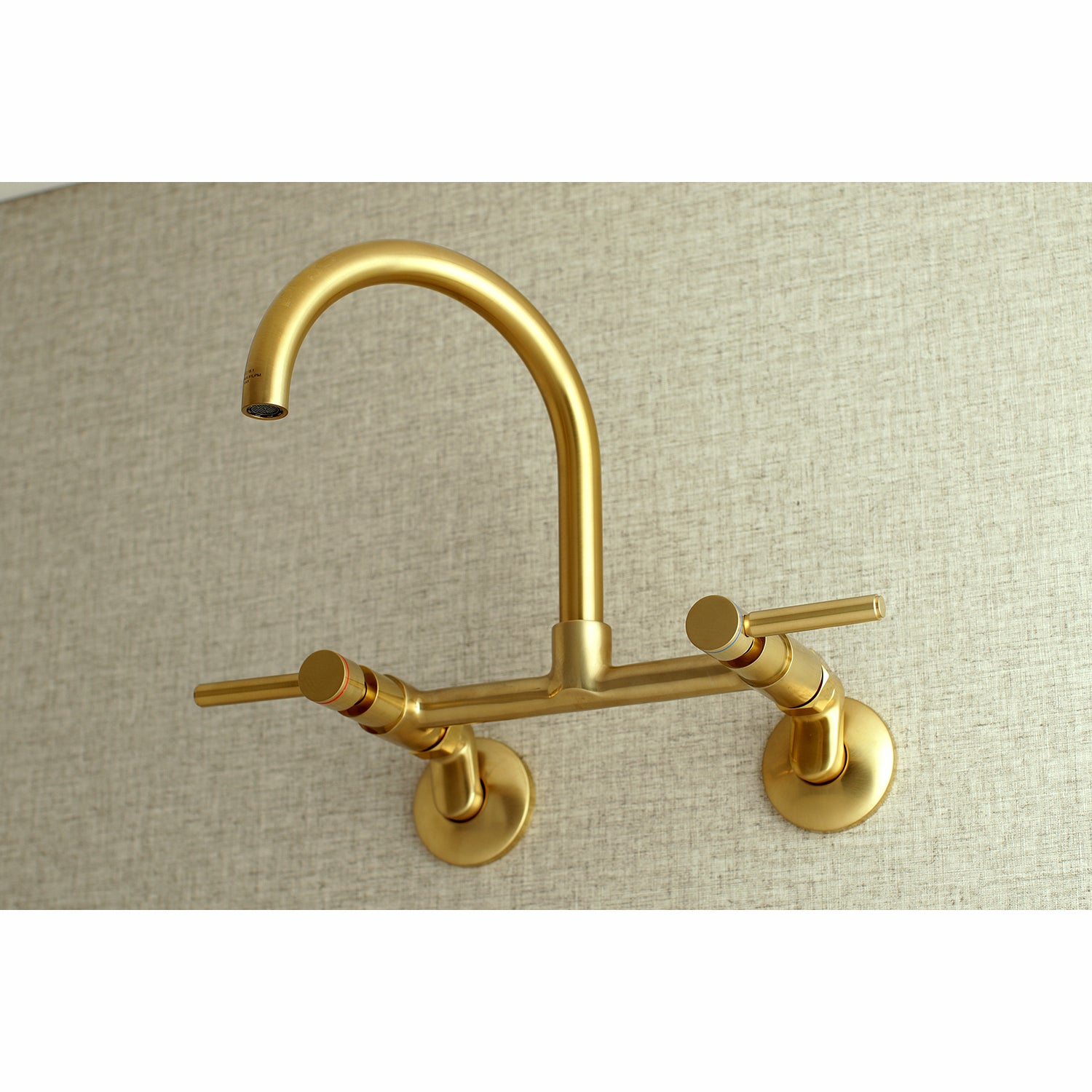 Kingston Brass KS814SB Concord Wall Mount Bridge Kitchen Faucet in a modern gold finish