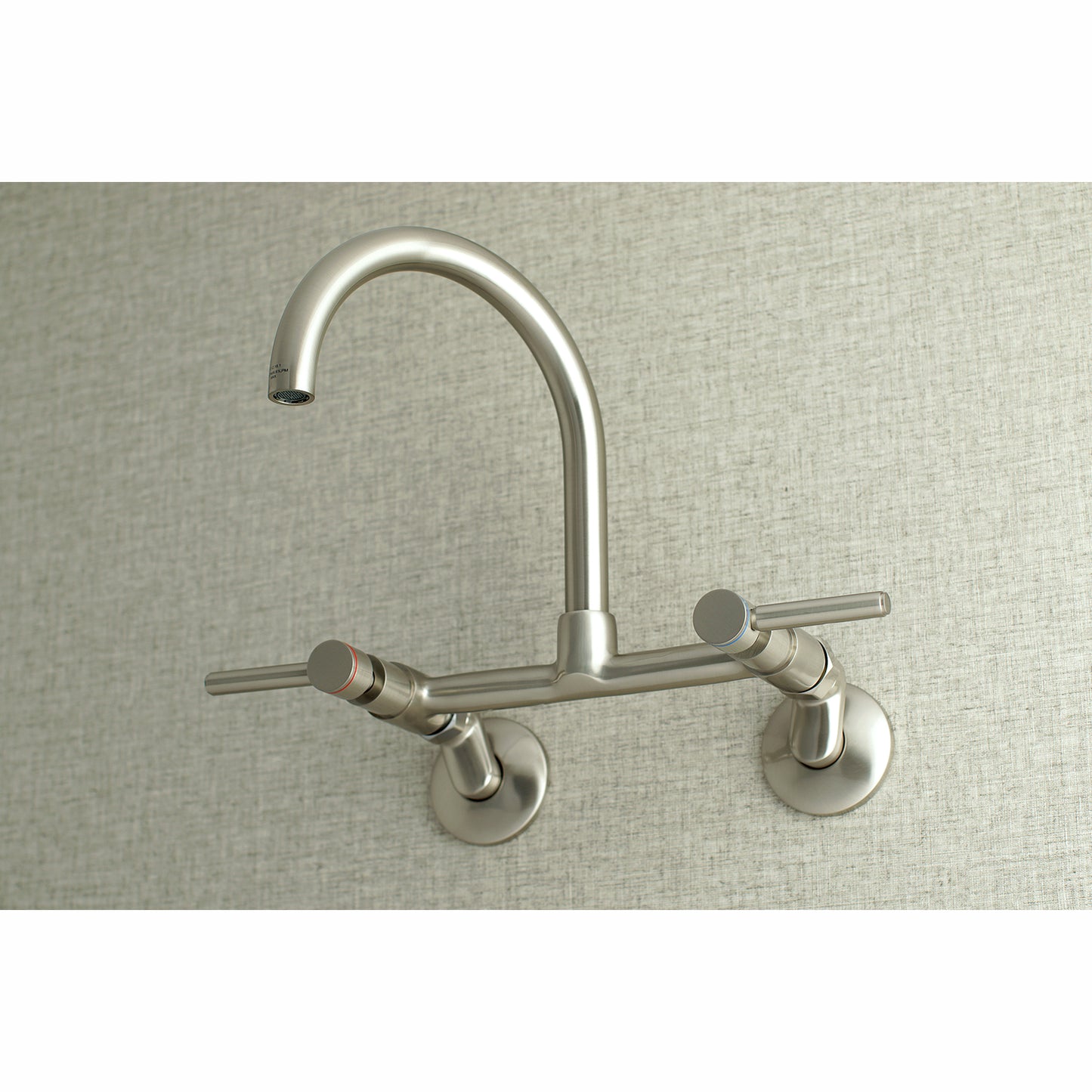 Kingston Brass KS814SB Concord Wall Mount Bridge Kitchen Faucet in a sleek stainless steel finish.