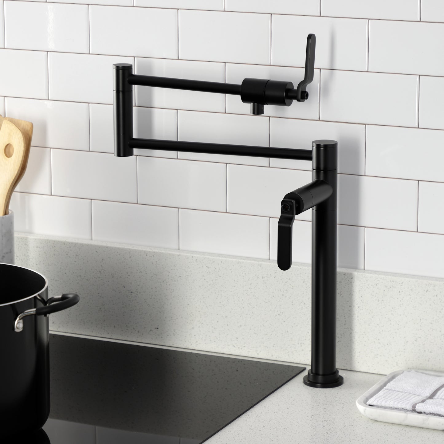 Kingston Brass KS4703KL Whitaker Deck Mount Pot Filler Faucet, Antique Brass installed over a modern kitchen countertop.