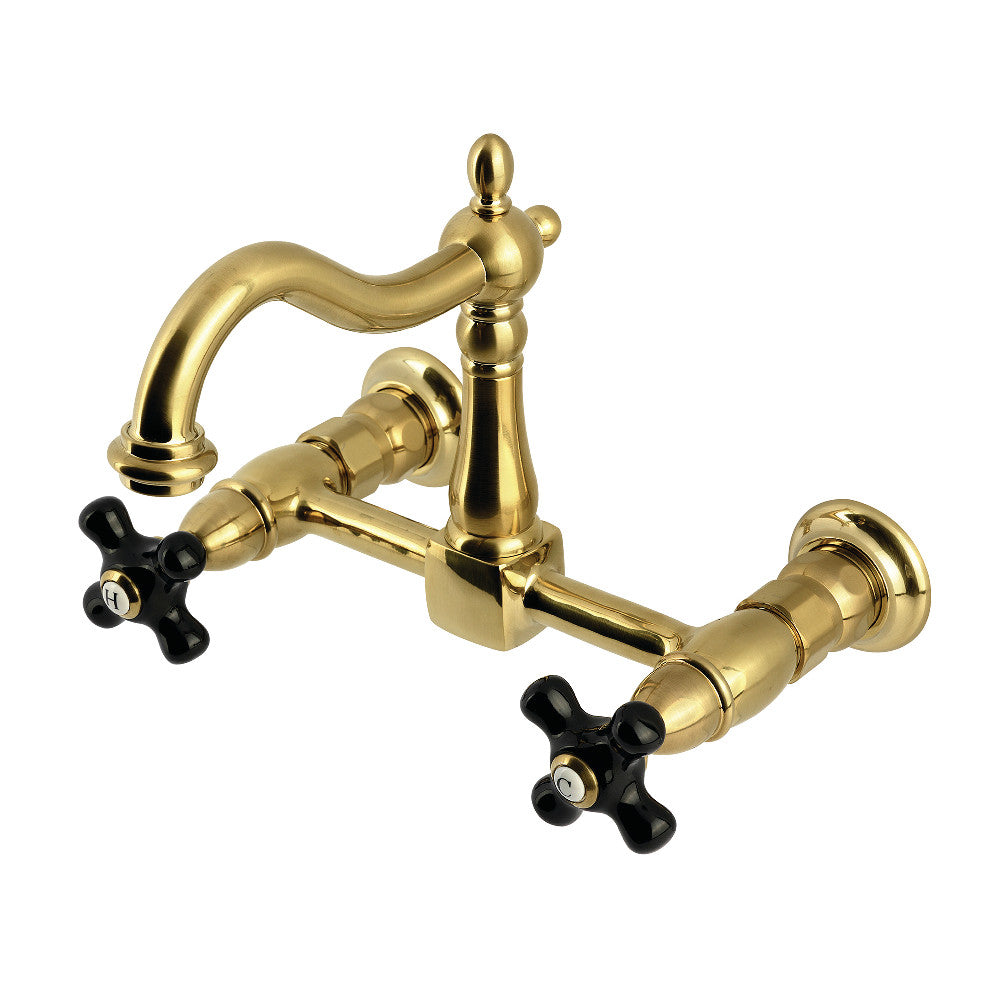 Kingston KS1263PKX Duchess Two-Handle Wall Mount Bridge Kitchen Faucet, Antique Brass with black porcelain handles.
