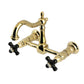 Kingston KS1263PKX Duchess Two-Handle Wall Mount Bridge Kitchen Faucet, Antique Brass with black porcelain handles.
