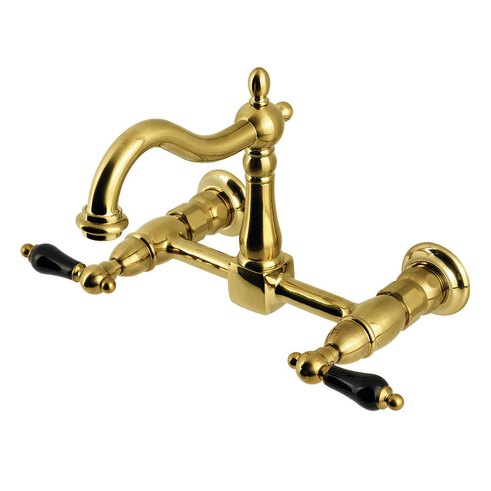 Kingston KS1263PKL Duchess Two-Handle Wall Mount Bridge Kitchen Faucet, Antique Brass with black porcelain handles.
