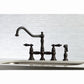 Kingston KS3277PKLBS Duchess Bridge Kitchen Faucet with Brass Sprayer, Brushed Brass in a kitchen setting