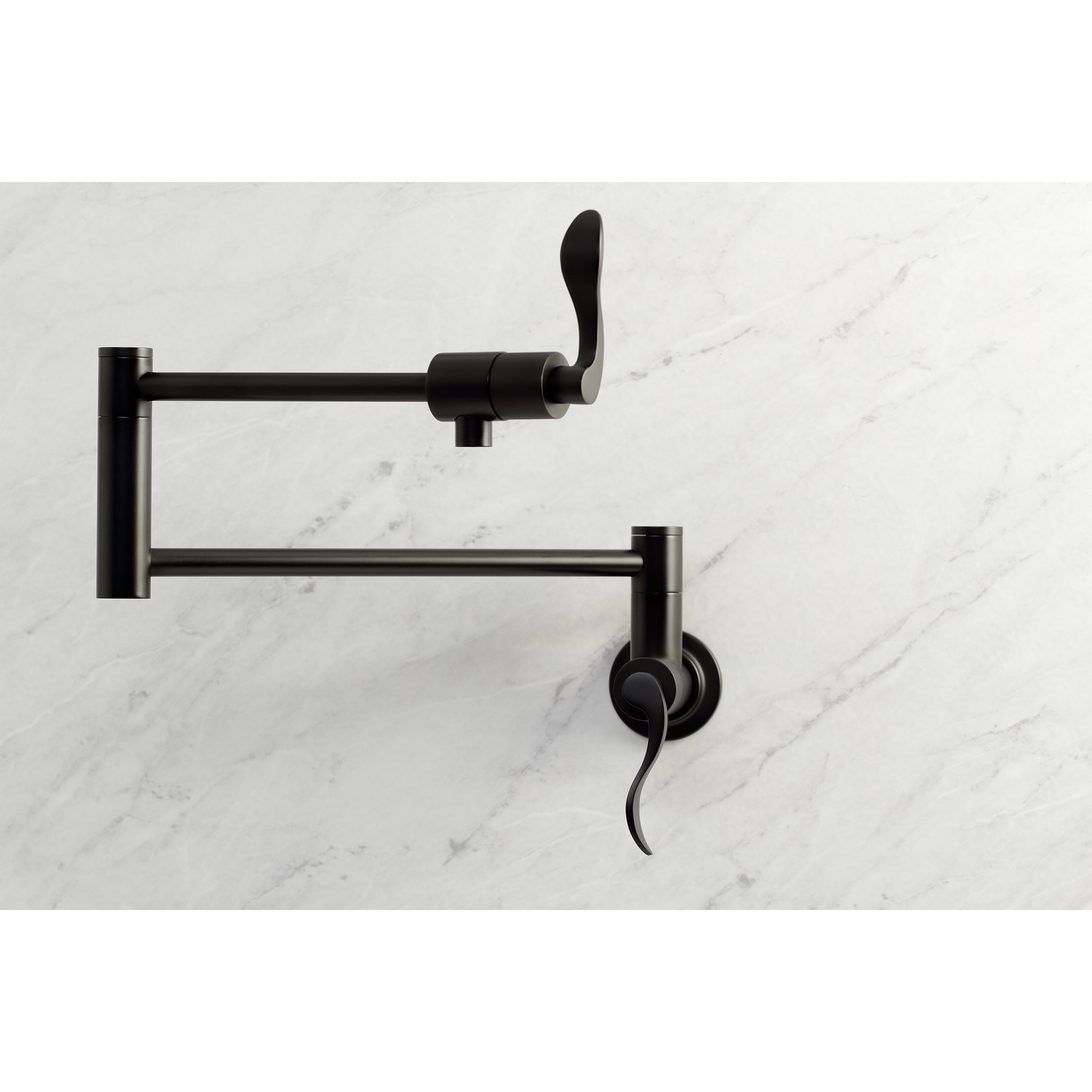 Kingston Brass KS4103DFL NuWave Wall Mount Pot Filler Faucet, Antique Brass on a marble background.
