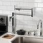 Kingston Brass KS4703CML Manhattan Deck Mount Pot Filler Faucet, Antique Brass in a modern kitchen setup.