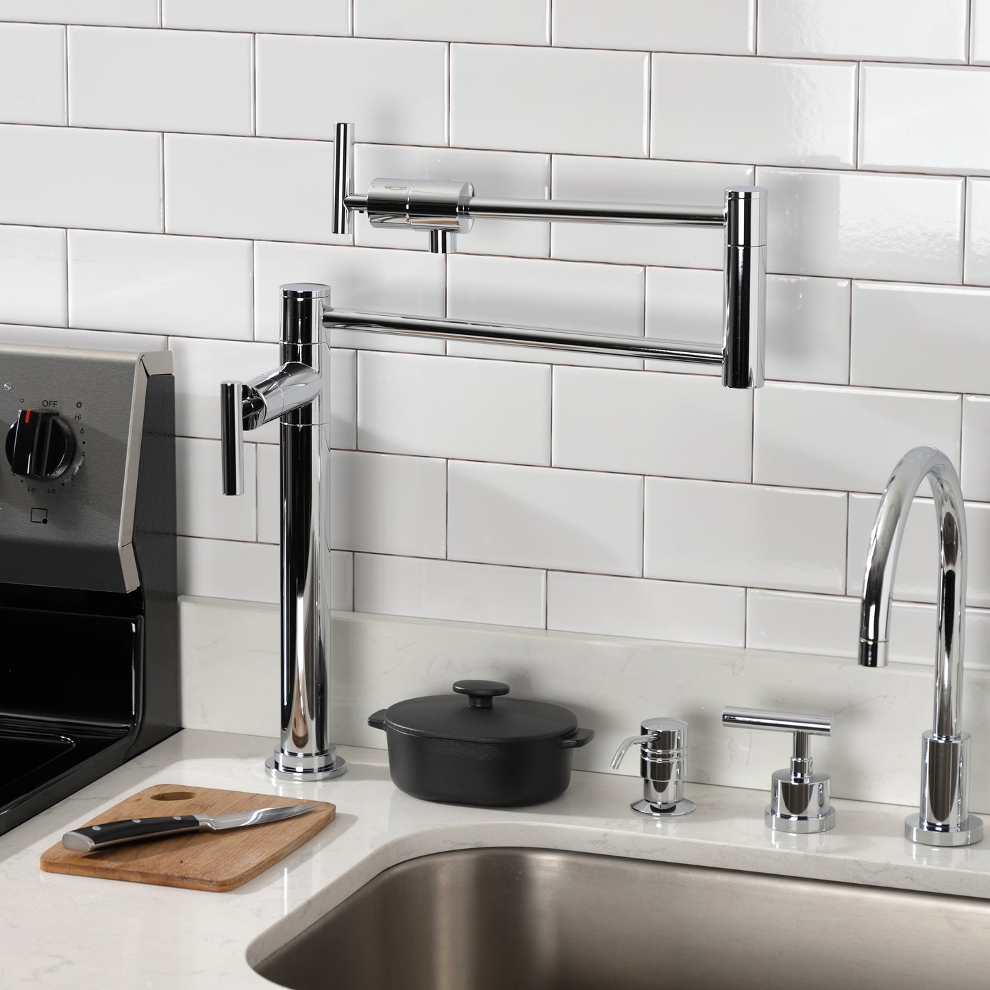 Kingston Brass KS4703CML Manhattan Deck Mount Pot Filler Faucet, Antique Brass in a modern kitchen setup.