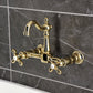 Kingston KS2443AX Heritage Two-Handle Wall Mount Bridge Kitchen Faucet, Antique Brass in a luxurious gold finish
