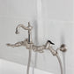 Kingston KS2443ALBS Heritage Two-Handle Wall Mount Bridge Kitchen Faucet with Brass Sprayer, Antique Brass in a sleek design.