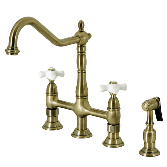 Kingston Brass Heritage Bridge Kitchen Faucet with Brass Sprayer and Cross Handles in Antique Brass finish
