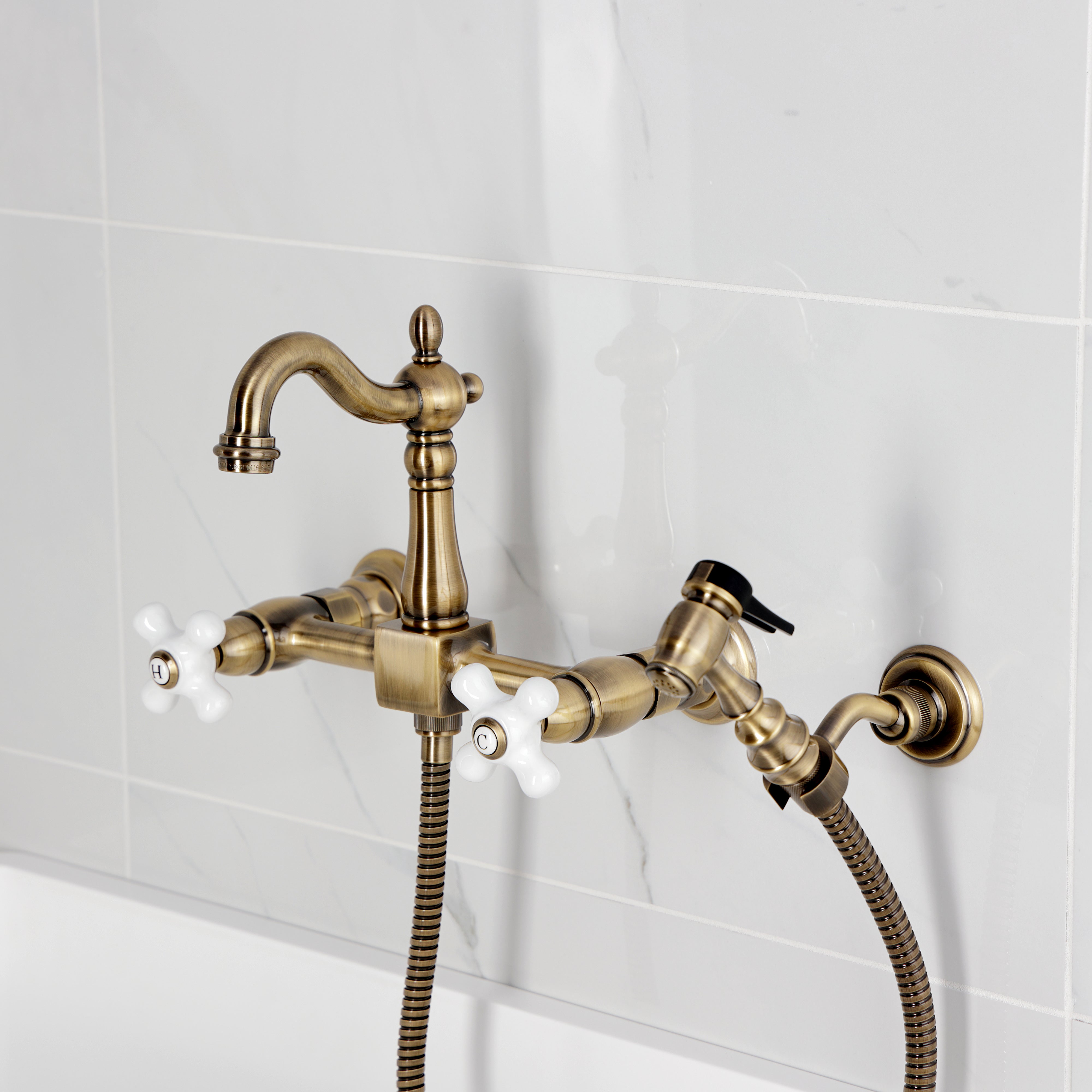 Kingston KS2443PXBS Heritage Two-Handle Wall Mount Bridge Kitchen Faucet with Brass Sprayer, Antique Brass