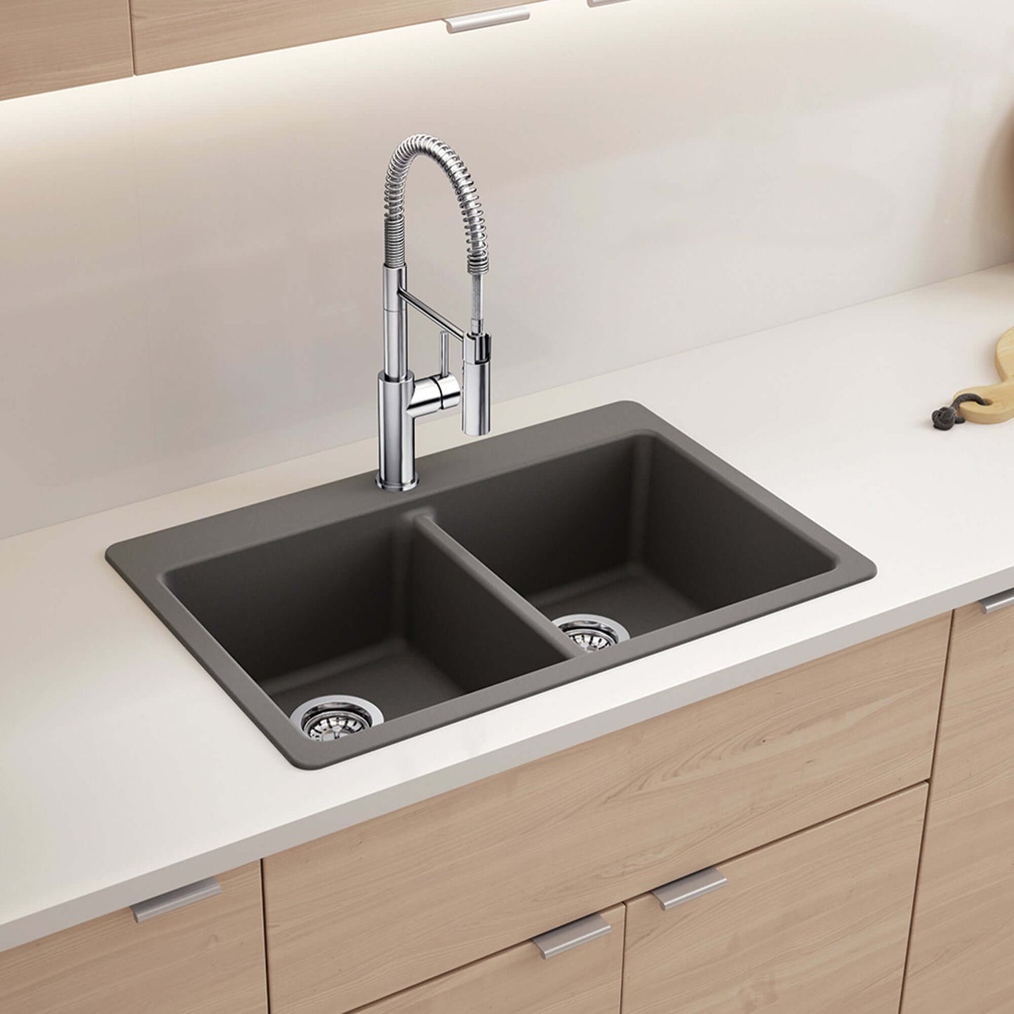 BLANCO Liven SILGRANIT 33" 50/50 Double Bowl Dual Mount Kitchen Sink with Low Divide on a countertop with faucet.