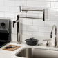 Kingston Brass KS4703CML Manhattan Deck Mount Pot Filler Faucet, Antique Brass countertop installation with modern kitchen decor.