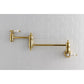 Kingston Brass KS3103BPL Bel-Air Wall Mount Pot Filler Faucet, Antique Brass with porcelain levers and elegant design.