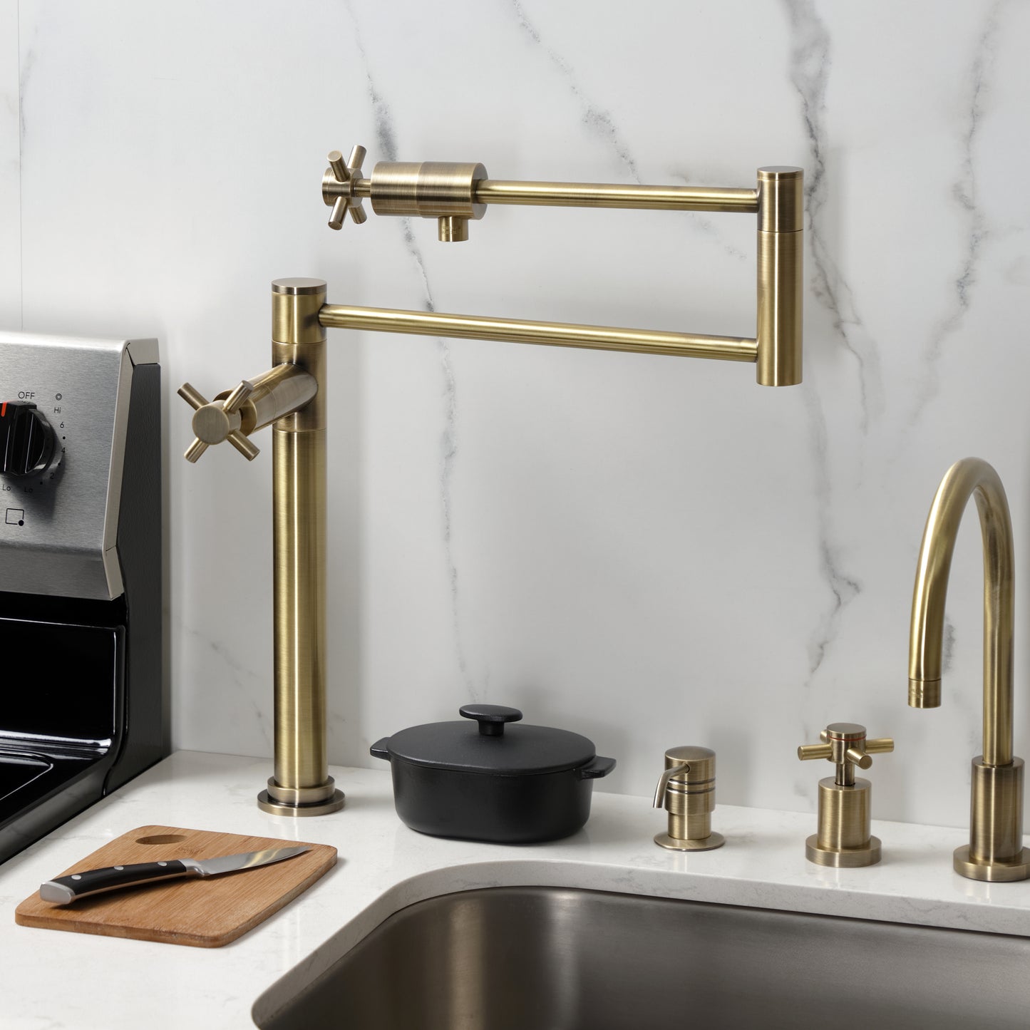 Kingston Brass KS4703DX Concord Deck Mount Pot Filler Faucet, Antique Brass in a modern kitchen setting.