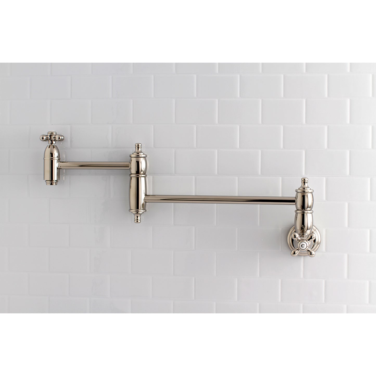 Kingston Brass KS3103AX Restoration Wall Mount Pot Filler Faucet, Antique Brass on tiled wall background.