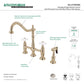 Kingston Brass Heritage Bridge Kitchen Faucet with Brass Sprayer and Cross Handles in Polished Nickel.
