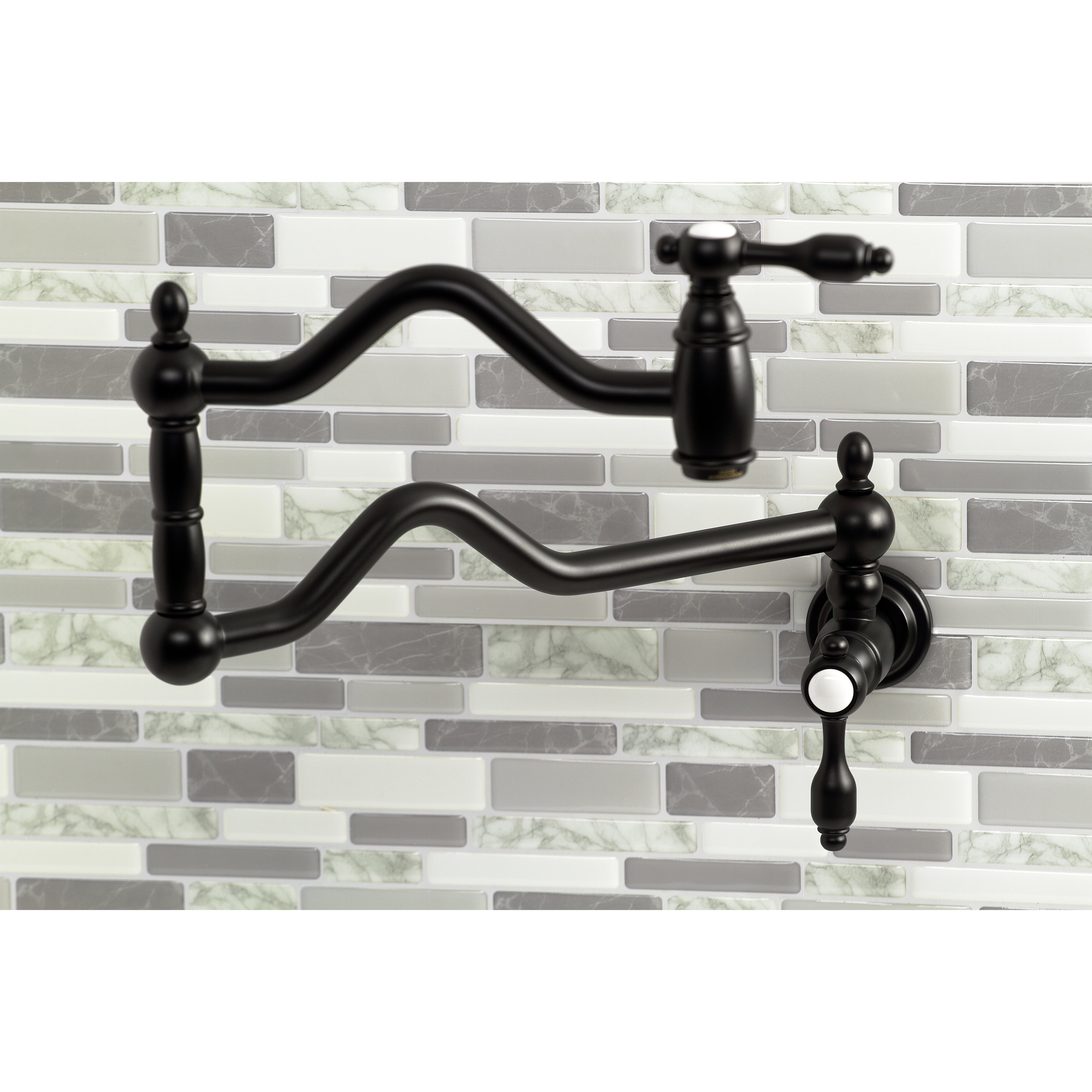 Kingston Brass KS2107TAL Tudor Wall Mount Pot Filler Faucet, Brushed Brass against a modern tile backsplash.