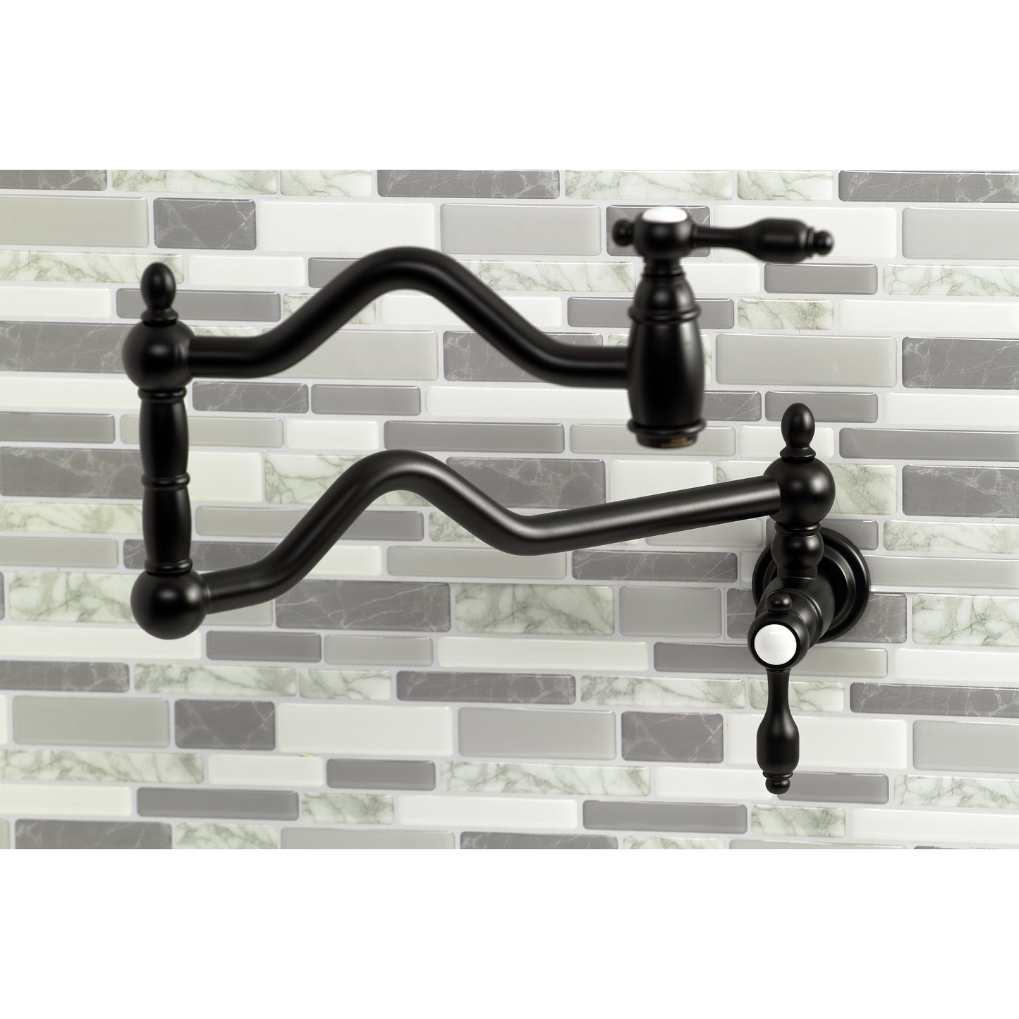 Kingston Brass KS2107TAL Tudor Wall Mount Pot Filler Faucet, Brushed Brass against a modern tile backsplash.