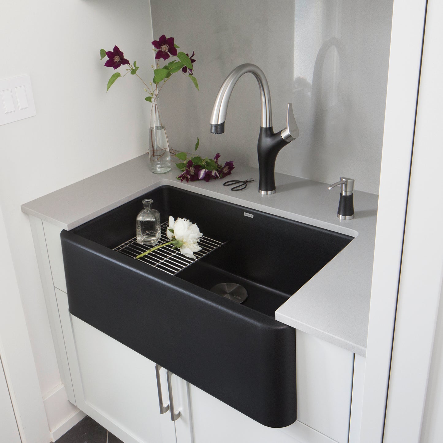BLANCO Ikon SILGRANIT 30" Single Bowl Apron-Front Farmhouse Sink with modern faucet and floral decor.