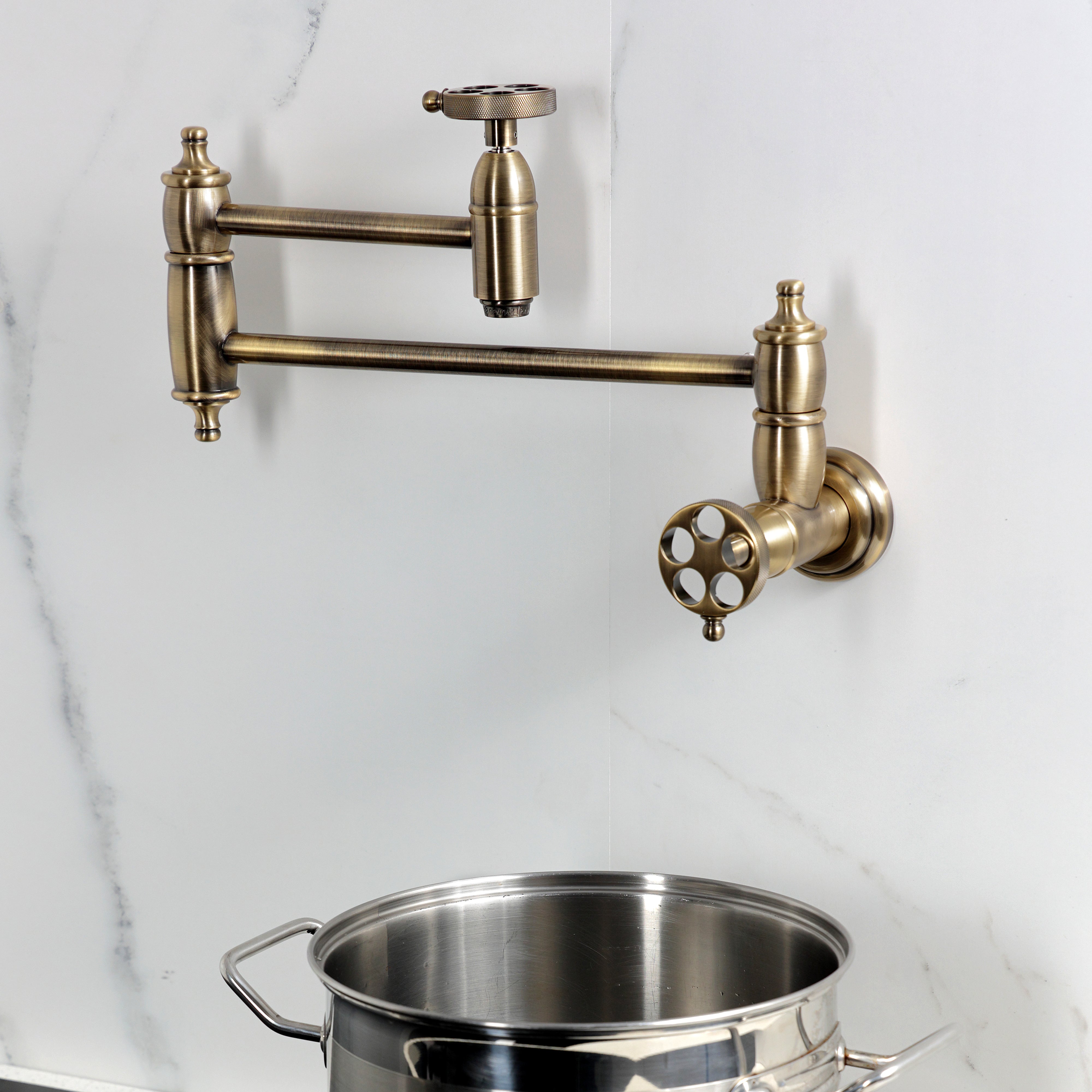 Kingston Brass KS3103RKZ Wendell Wall Mount Pot Filler Faucet with Knurled Handle, Antique Brass on wall