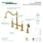 Kingston Brass Heritage Bridge Kitchen Faucet with Brass Sprayer and Cross Handles in Polished Brass finish, featuring a high-arch spout.